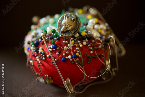 Well-used pincushion; Studio photo