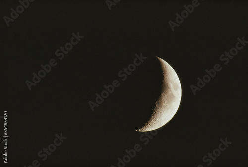 Night view of a crescent moon; Laramie, Wyoming, United States of America photo