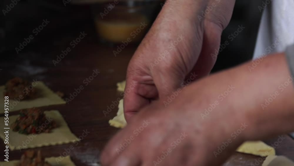 Video of preparation of small empandas. Concept of traditional cooking.
