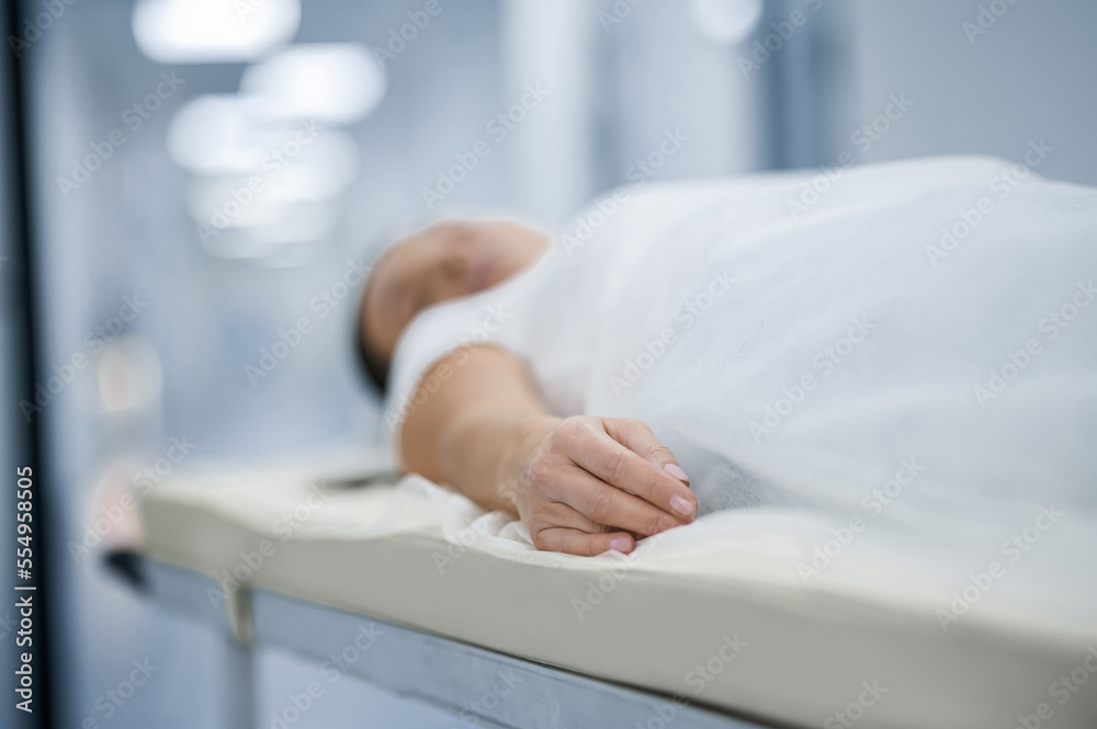 A woman lying on a gurney befre diagnostic procedure A woman lying on a gurney befre diagnostic procedure