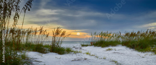 Panoramic view of sun setting over Holmes Beach in Florida. photo