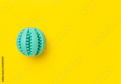 Blue ball toy for dogs on color background