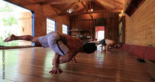 Yogis training together. Group practicing Yoga