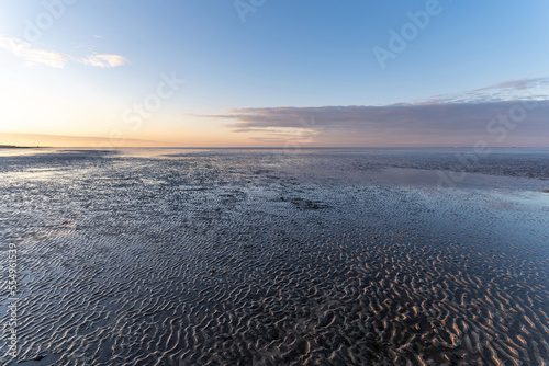 Wadden Sea in Cuxhaven, Germany at sunset photo