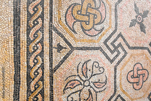 Ancient Italian Roman mosaic floor with geometric shapes compose