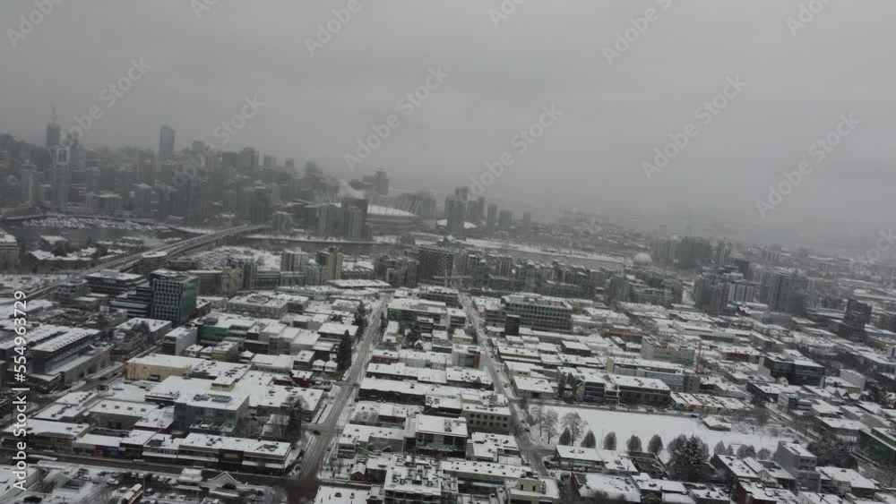 Tilted flight over the Vancouver city covered with the snow and downtown on BG Tilted flight over the Vancouver city covered with the snow and downtown on BG