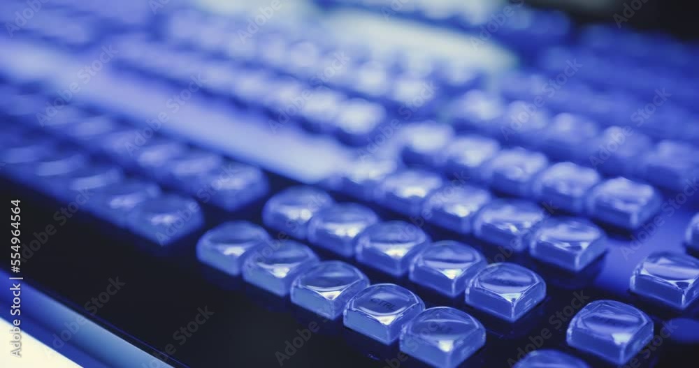 Smooth camera pan hundreds of individual illuminated buttons on futuristic control panel