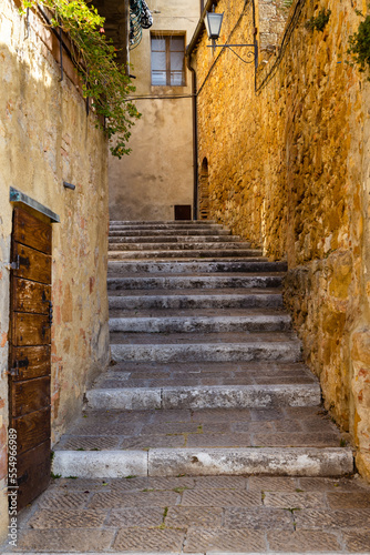 Fototapeta Naklejka Na Ścianę i Meble -  stony staircase in Tuscany, surrounded by stony walls