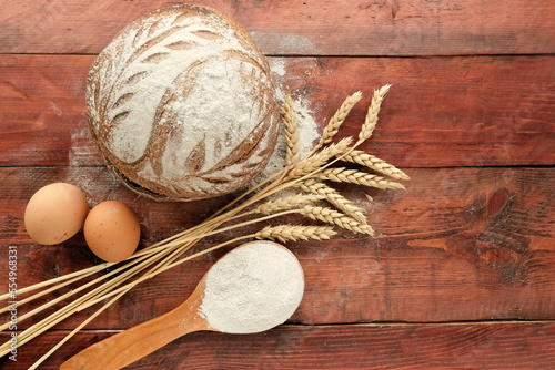 Bread, wheat on a wooden board. The concept of harvest, the production of bread products.