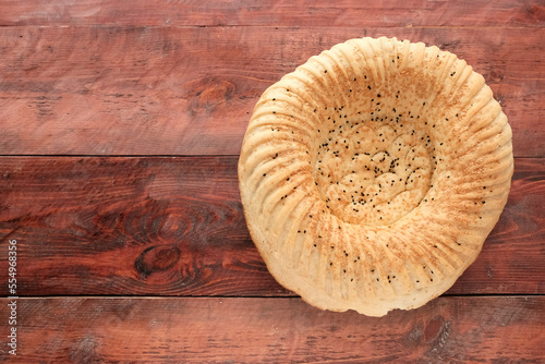 Bread, wheat on a wooden board. The concept of harvest, the production of bread products.