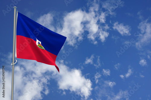 Republic of Haiti flags over blue sky background. 3D illustration