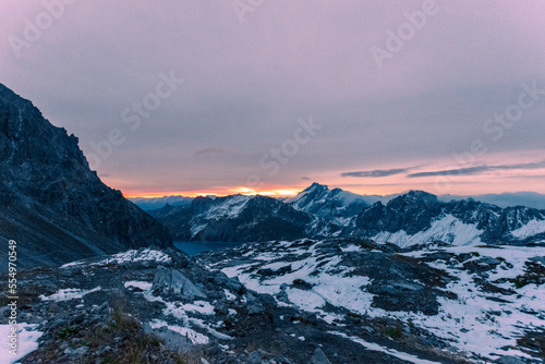 sunrise over the snowy mountains during spring (Lünersee, Vorarlberg, Austria)