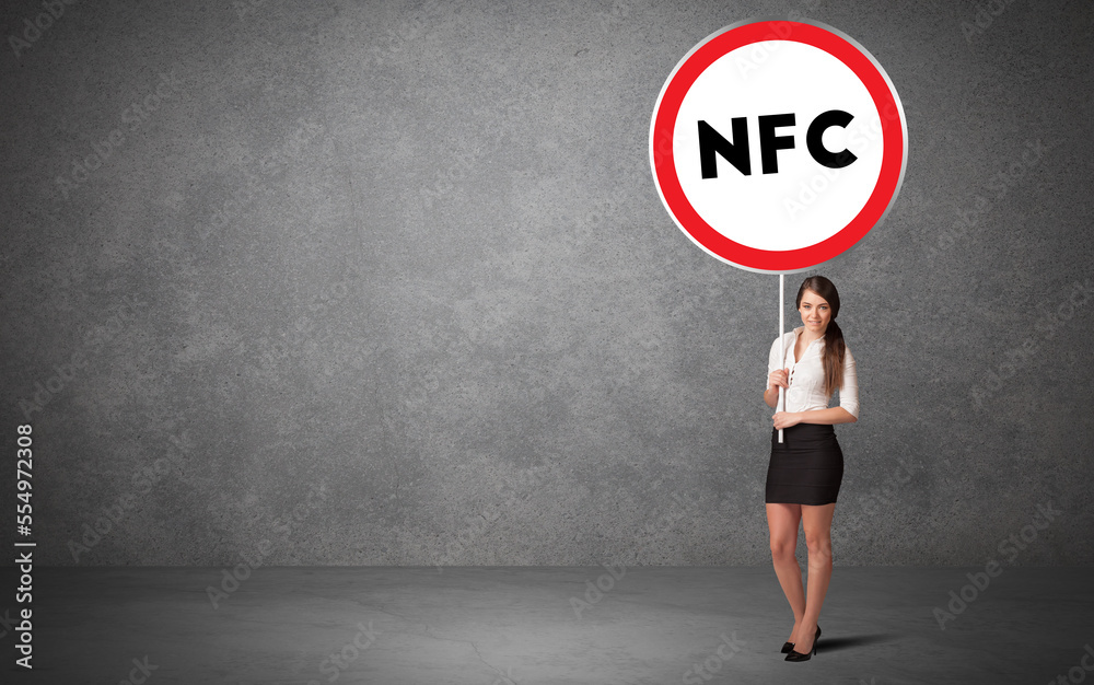 Young business person holdig traffic sign Young business person holdig traffic sign