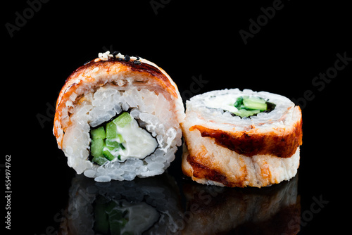 Japanese cuisine maki sushi rolls with smoked eel, cream cheese and cucumber.