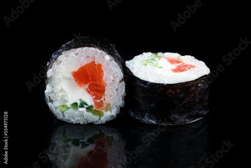 Japanese kitchen maki sushi rolls with salmon, cream cheese and cucumber.