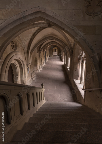 Aisle of a historic monastery.