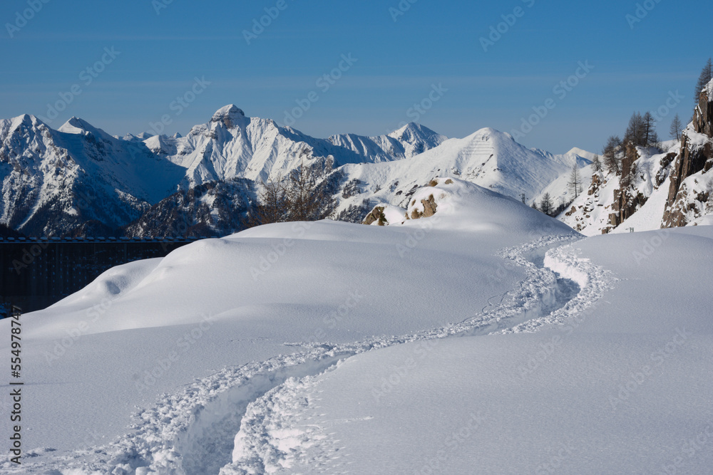 Alpine footpath in the snow. In the background the Bergamasque Alps ( Orobie ), Italy