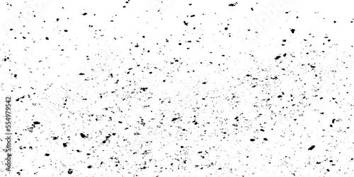 Small uneven spots and particles of debris. Abstract vector texture. Distressed uneven background. Grunge texture overlay with fine grains isolated on white background. Vector illustration. EPS10.