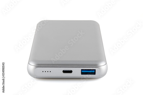 Additional autonomous power bank for charging mobile devices. External battery isolated on white background. Silver charger for a smartphone with a power supply (battery). Full depth of field.