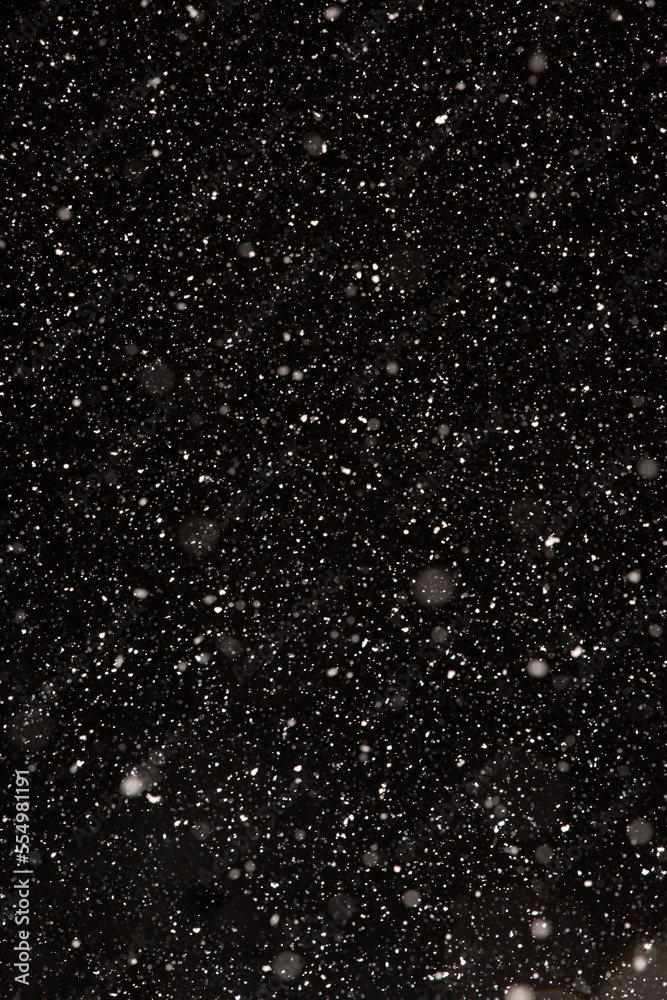 Snow Falling at Night on a Black Background Snow Falling at Night on a Black Background
