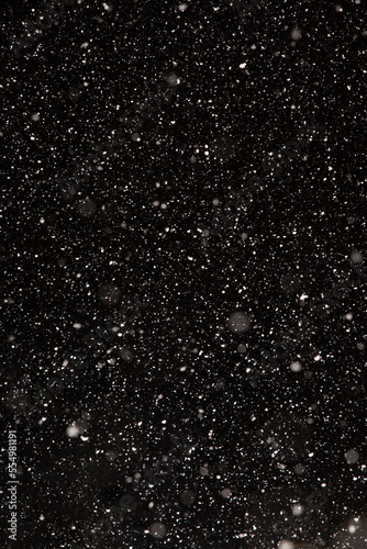 Snow Falling at Night on a Black Background