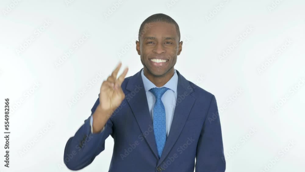 African Businessman with Victory Sign on White Background African Businessman with Victory Sign on White Background