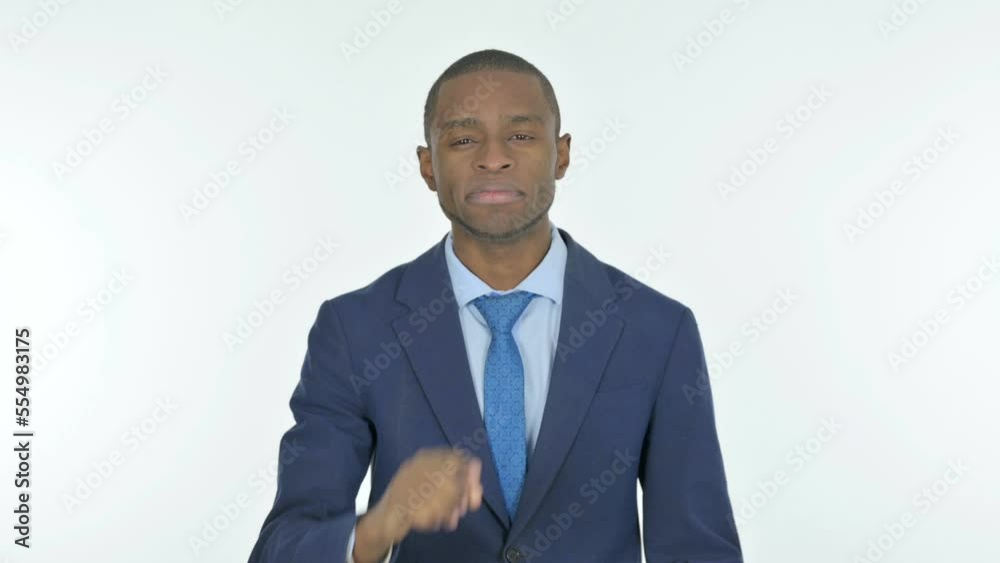 African Businessman with Finger on Lips Asking for Silence on White Background African Businessman with Finger on Lips Asking for Silence on White Background