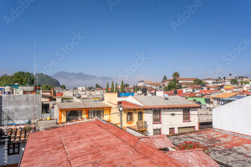 Beautiful sunny day in mountain city 
 in Mexico. The famous tiled roofs of the city.
