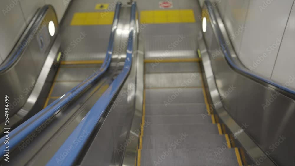 This POV video shows a view of going down an escalator. This POV video shows a view of going down an escalator.