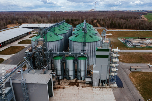 Automatic agricultural grain dryer and silos, aerial view. Modern complex for drying, cleaning and storage grain © Mulderphoto