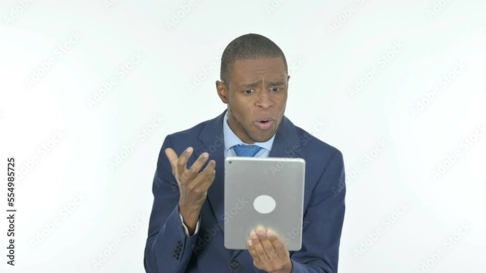 African Businessman with Loss on Tablet on White Background African Businessman with Loss on Tablet on White Background