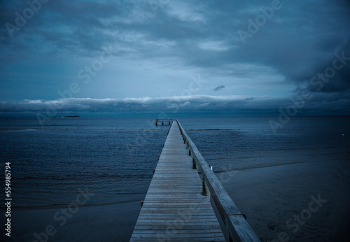 pier on the beach © Layman's Lens