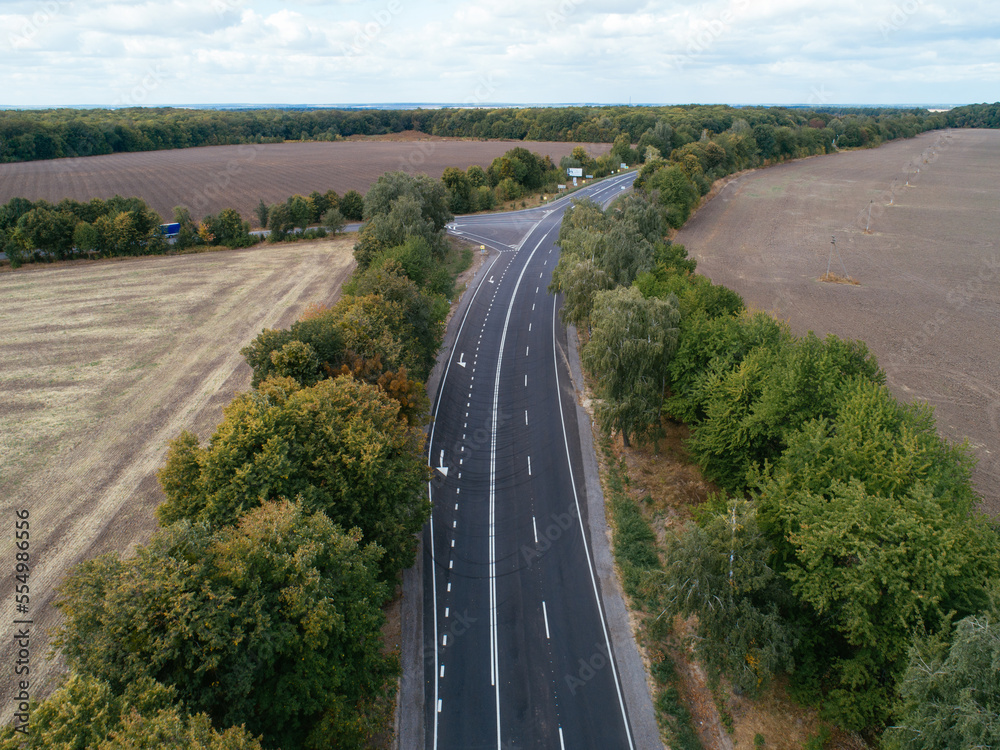 Aerial view asphalt road and green forest, Forest road going through forest with car adventure view from above, Ecosystem and ecology healthy environment concepts and background.