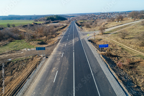 Aerial view asphalt road and green forest, Forest road going through forest with car adventure view from above, Ecosystem and ecology healthy environment concepts and background.