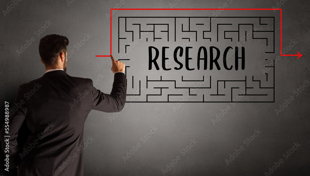 businessman drawing maze concept businessman drawing maze concept