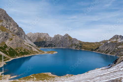 Lünersee in the Austrian Alps with snowy slopes (Vorarlberg, Austria)