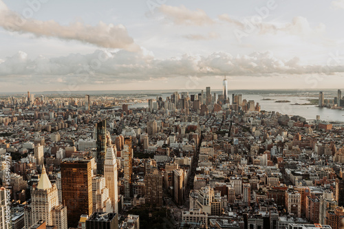 A bird's eye view of New York City's skyscrapers and apartment buildings. Aerials view of Manhattan from the Empire State Building