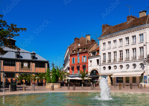 Cityscape of old French town of Sens with shops and outdoors cafe at summer