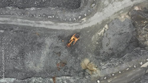 Aerial view of excavator in granite quarry