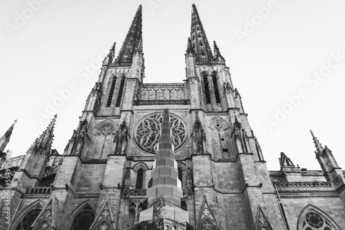 Glass Christmas tree in front of the cathedral in Bordeaux, France. Reflection of street buildings in glass. Urban winter holidays celebration background. Black white historic photo