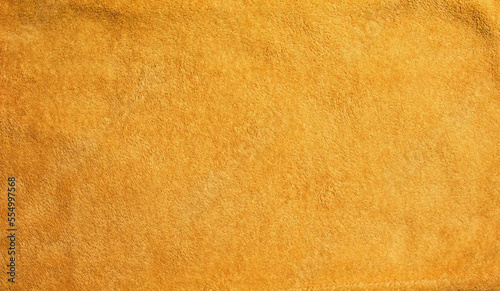 Yellow terry cloth for towels. Yellow fabric and texture concept. Close up terry cloth towel.