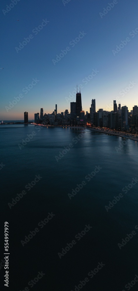 city skyline at night Chicago water 