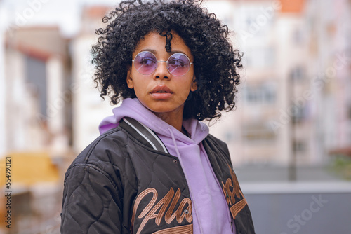 portrait afro urban girl with sunglasses on the street