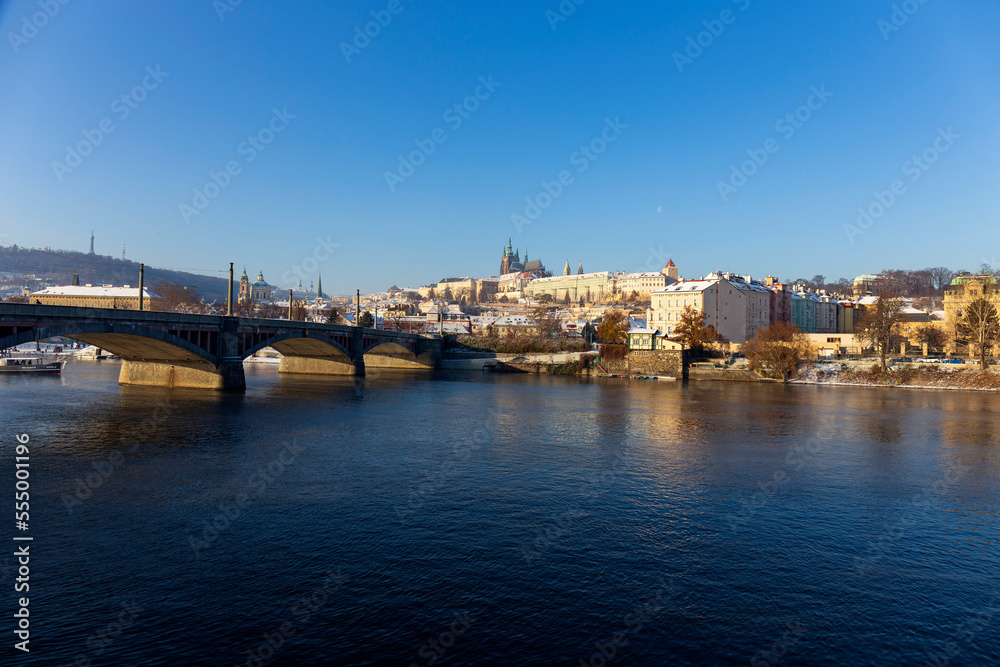 Snowy Prague Lesser Town with Prague Castle above River Vltava in the sunny Day , Czech republic