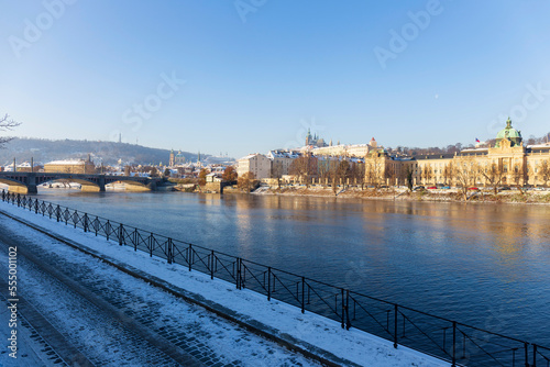 Snowy Prague Lesser Town with Prague Castle above River Vltava in the sunny Day , Czech republic