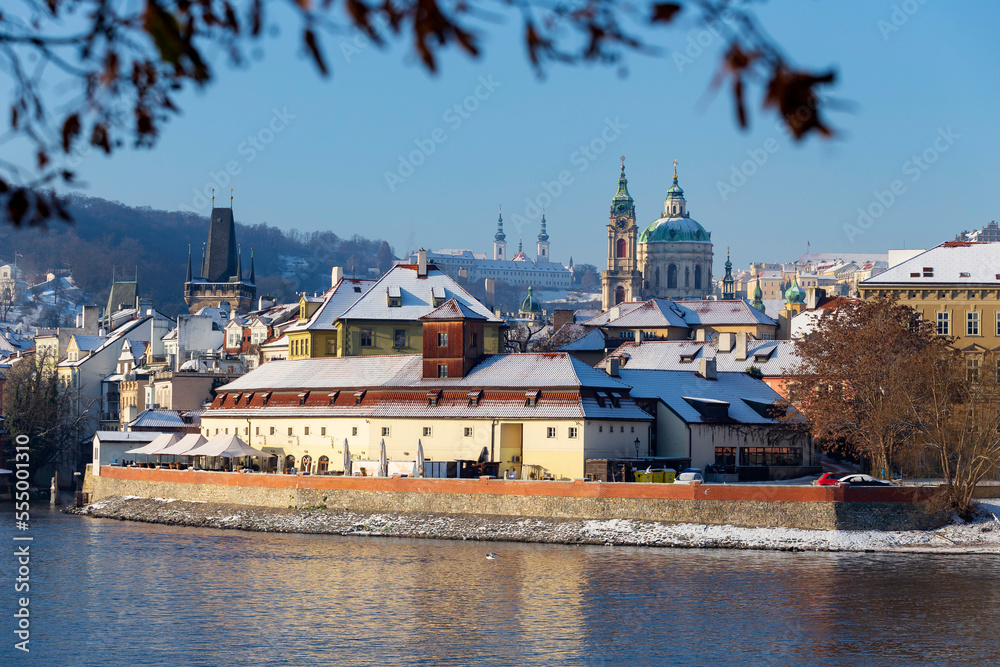 Snowy Prague Lesser Town with Prague Castle above River Vltava in the sunny Day , Czech republic