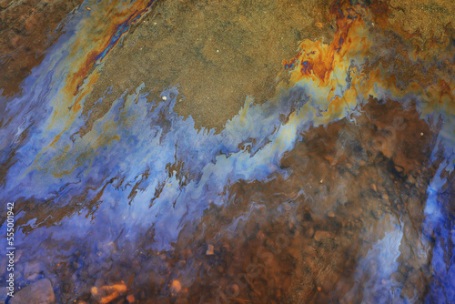spilled gasoline rainbow background, industrial hazard spill pollution, abstract texture multicolored © kichigin19