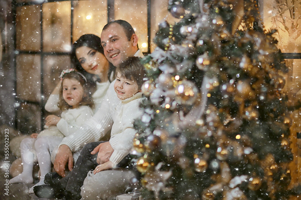 family with small children new year tree, december holidays at home family with small children new year tree, december holidays at home