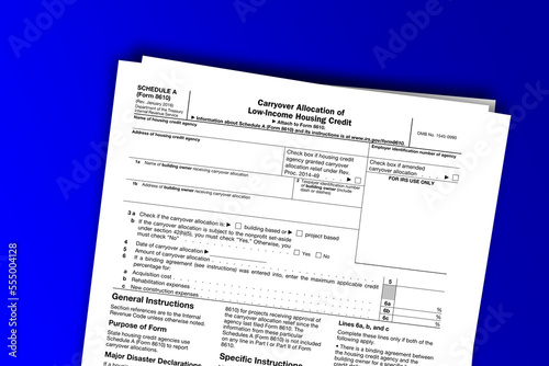 Form 8610 (Schedule A) documentation published IRS USA 01.16.2016. American tax document on colored