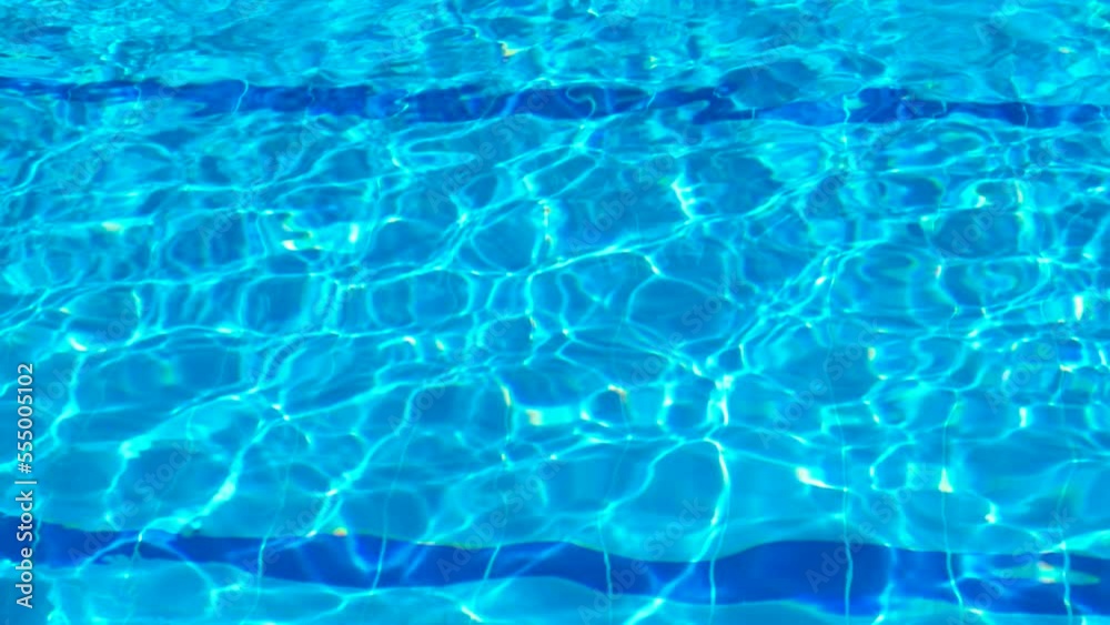 Forgotten empty swimming pool. A view of empty mosaic pool with warm clear water under sun. Forgotten empty swimming pool. A view of empty mosaic pool with warm clear water under sun.